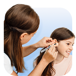 Woman cleaning a child's ear